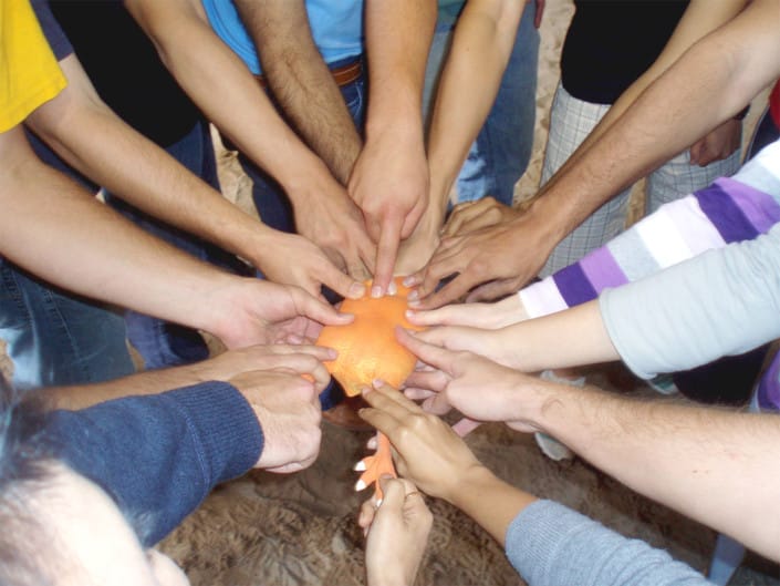 Team-touching-aim